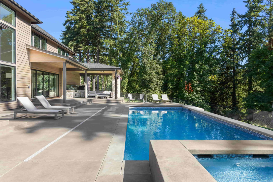 This is a beautiful concrete patio facing the forest that creates a terrific ambiance. This photo was taken in Surrey.